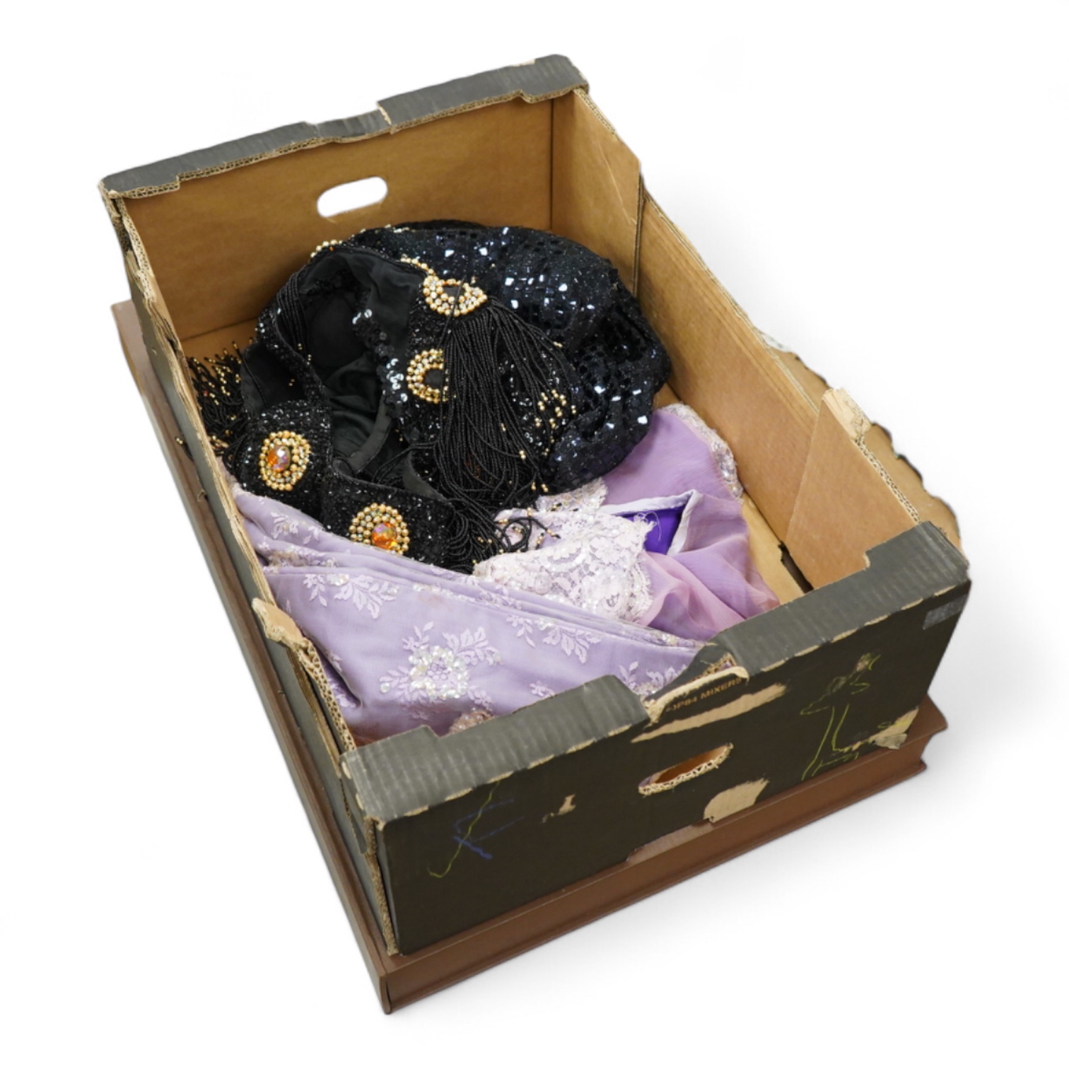 A late 20th century black sequinned, beaded and fringed evening dress, bust 36cm wide at front, together with a lilac chiffon, net, lace and sequin top and matching net evening skirt. Both outfits are a small size